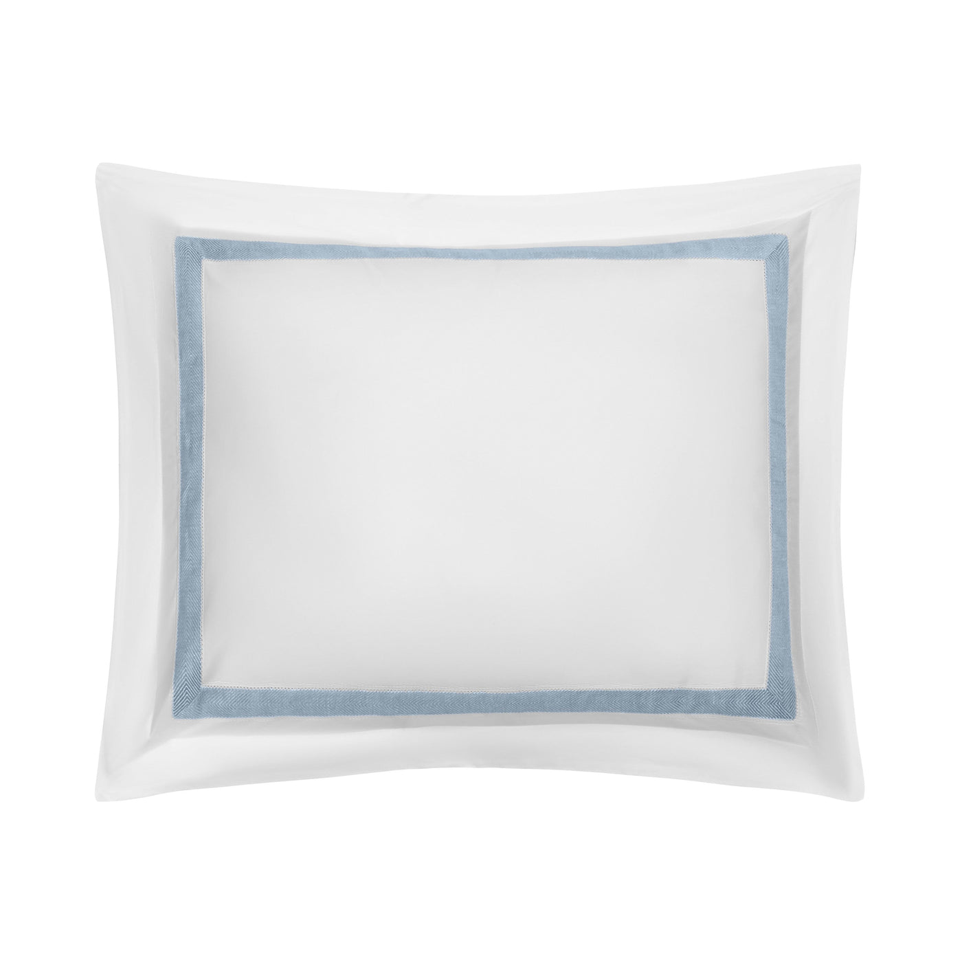 Close-up of white cotton pillow sham with dusty blue border trim and flange detail.