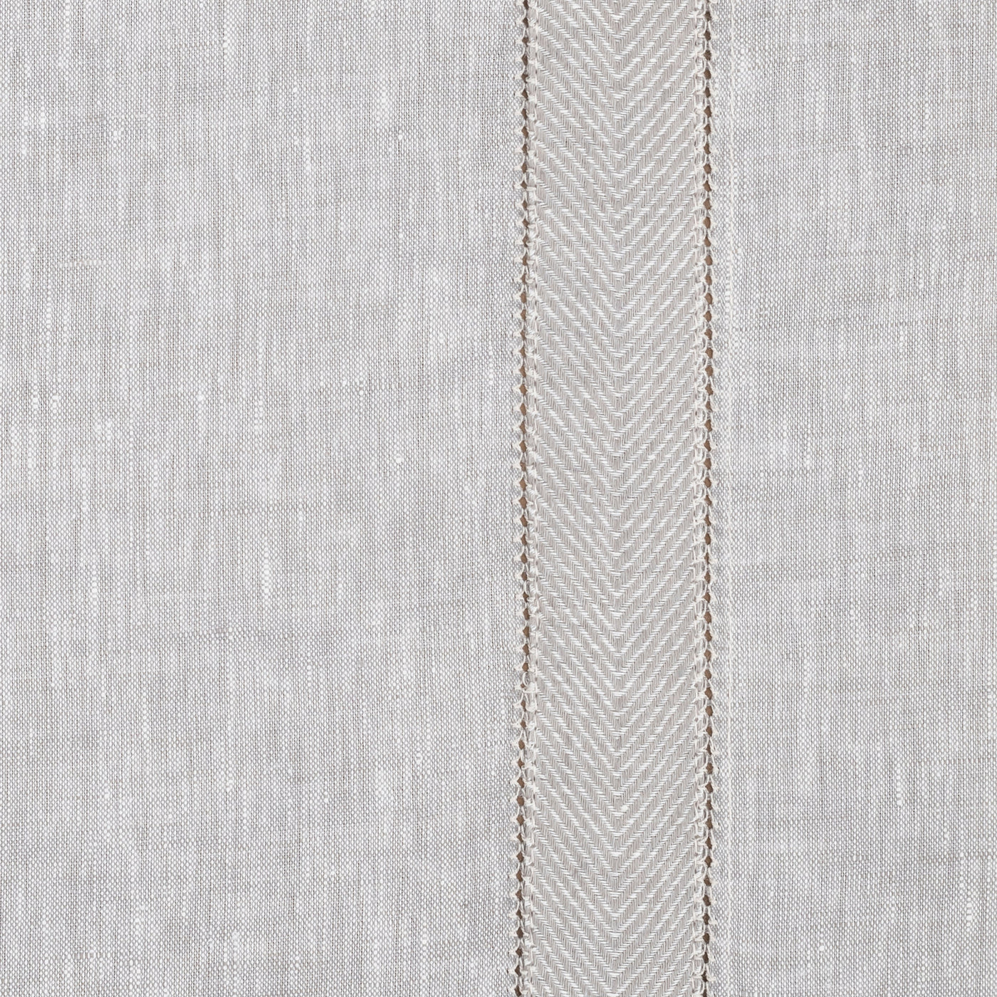 Close-up of ivory linen weave with a central herringbone embroidered border stripe.