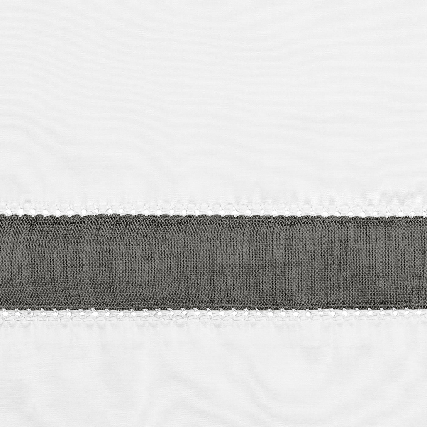 Close-up of charcoal woven linen band with white blanket stitch border detail.