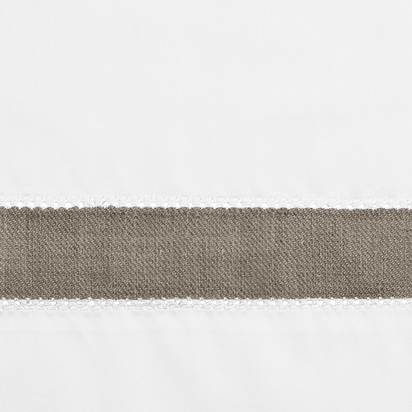 Close-up of taupe linen border trim with white crochet edging on white fabric.