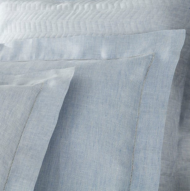Close-up of Home Treasures Zebra linen in sky blue herringbone weave with hemstitch border detail.