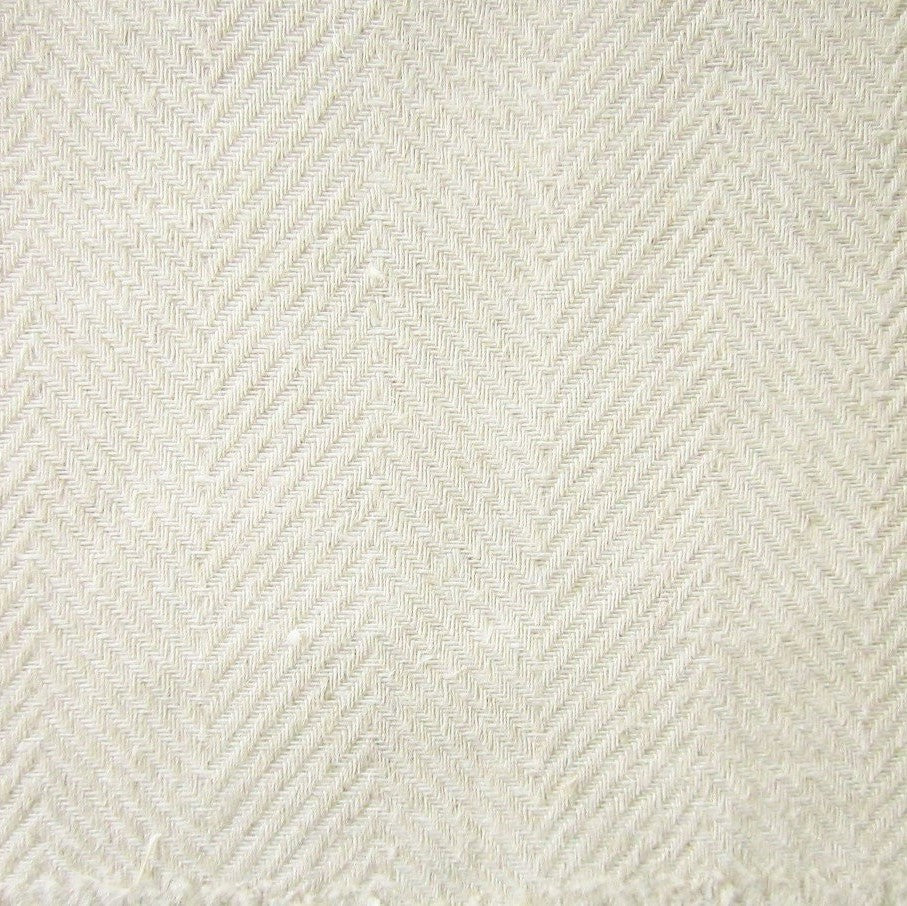 Close-up of ivory woven herringbone texture on Home Treasures Zebra quilted coverlet.