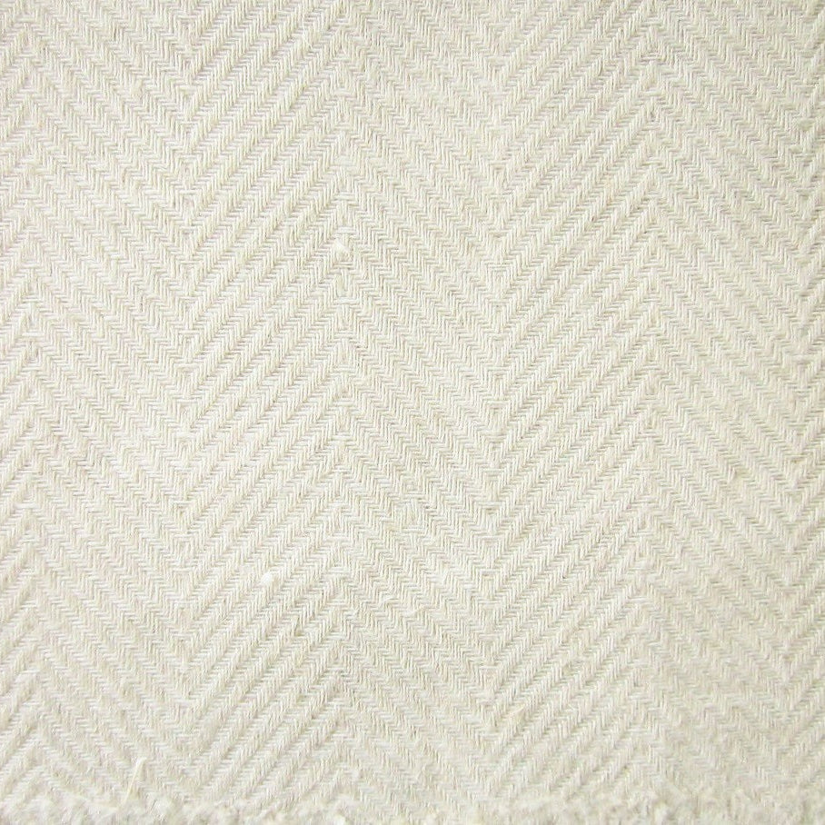 Close-up of ivory woven herringbone texture on Home Treasures Zebra tablecloth.