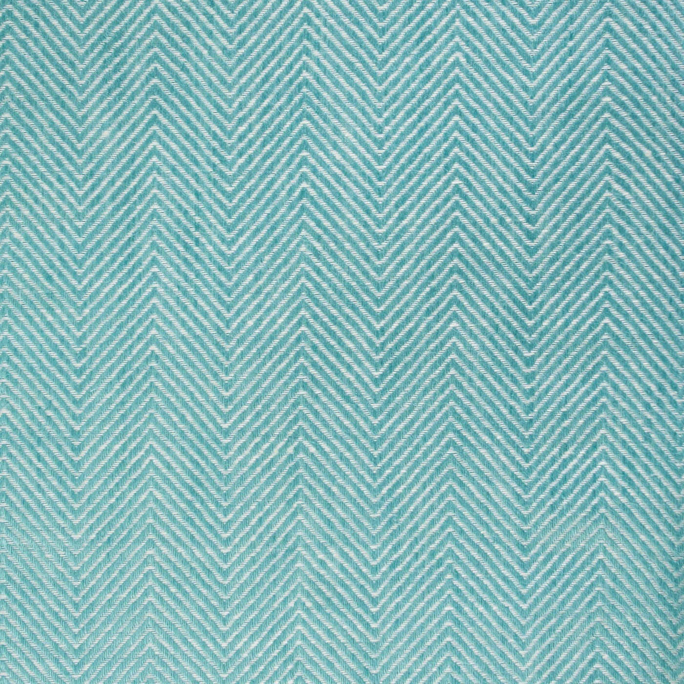 Close-up of turquoise and ivory woven herringbone pattern on Home Treasures Zebra placemat.