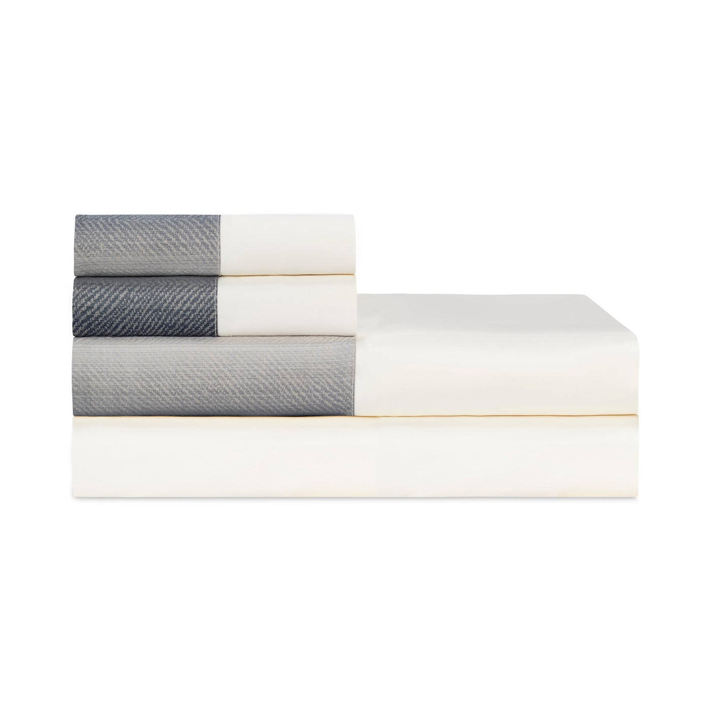 Close-up of folded ivory sheet set with slate herringbone contrast border detailing.