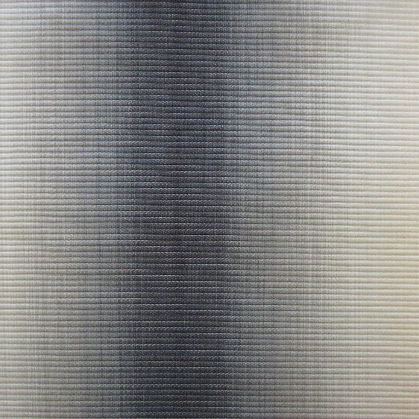 Close-up of Zurich fabric weave showing slate-to-ivory ombré gradient texture.