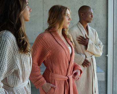 Image of three people in Abyss Pousada bathrobes