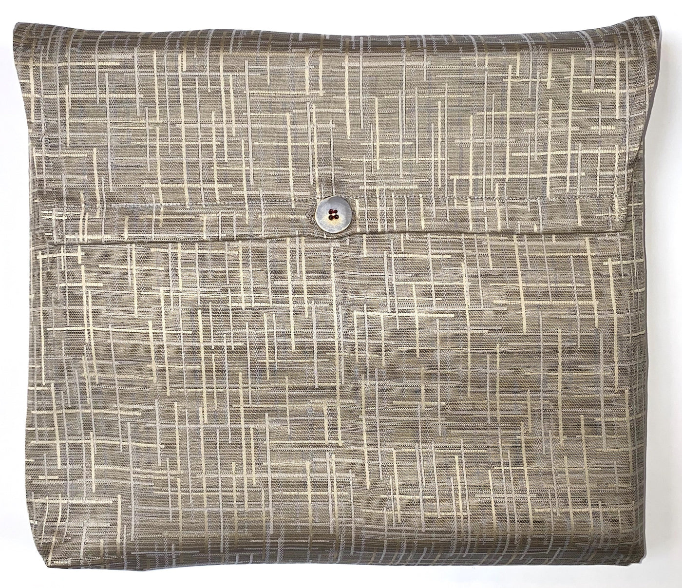 The Clearance Mosaico Jacquard Sham is a square fabric pouch with a geometric pattern, finished with a central button-secured flap closure.