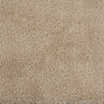 Close-up view of the LETTO Classic | Bath Rug, crafted from beige combed cotton with a soft, textured surface.