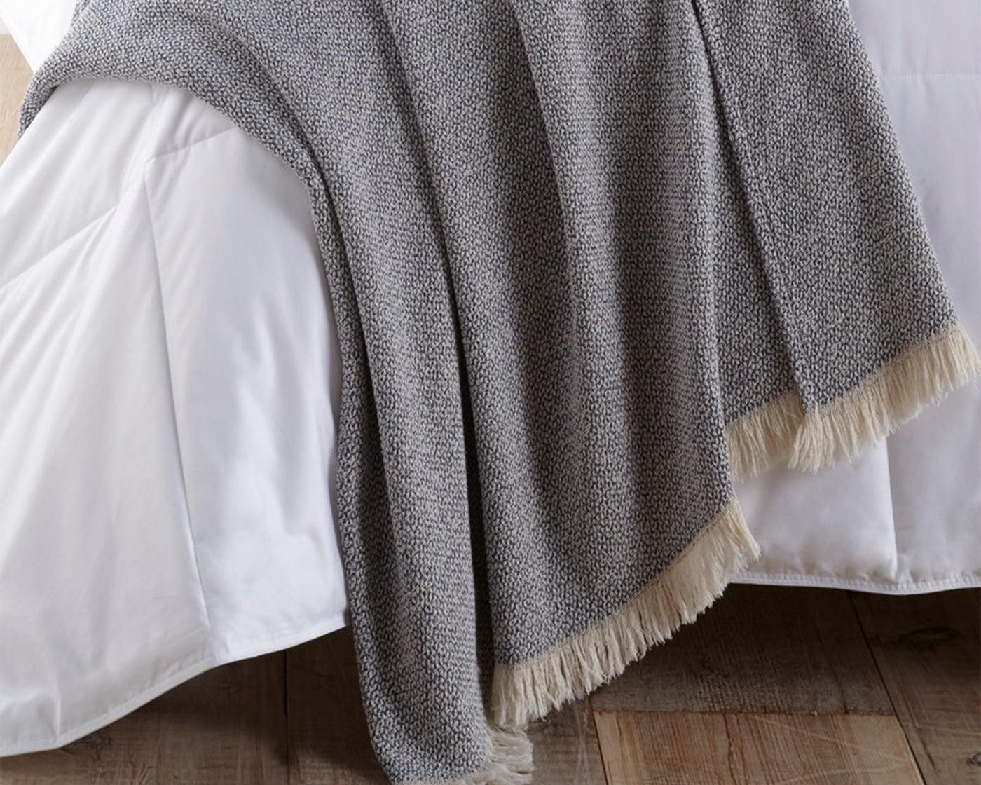 Peacock Alley Santa Fe blanket in gray, neatly stacked