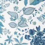 The Matouk Pomegranate Tissue Box Cover features a blue and white floral pattern inspired by Schumacher designs, showcasing leaves and flowers on a white background for a sophisticated botanical touch.