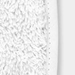 Close-up of white plush terry fabric texture with piped edge detail.