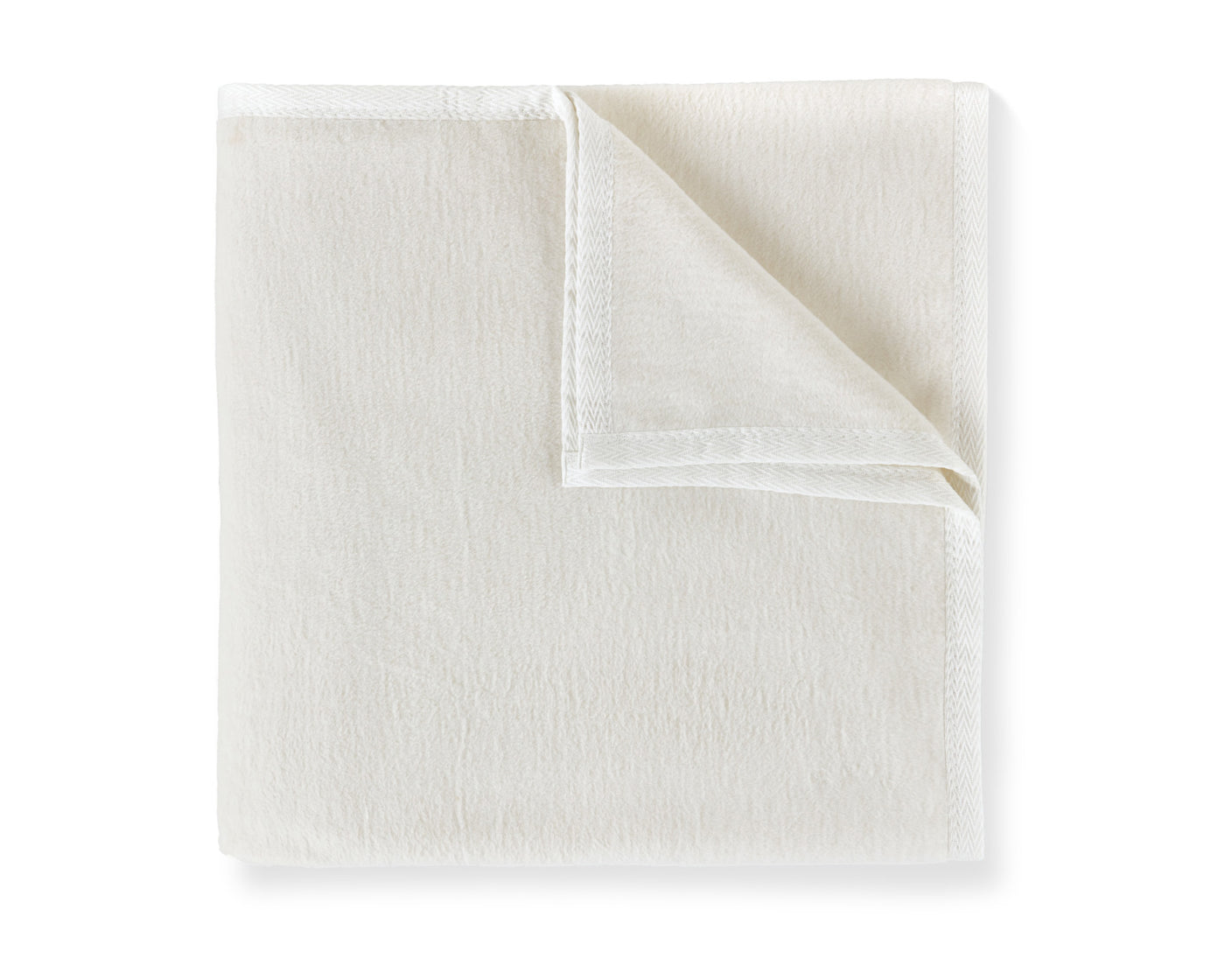  Peacock Alley's All Season blanket in white neatly folded