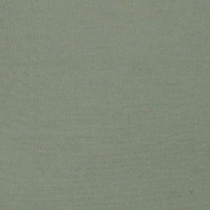 A close-up of Vintage Percale | Fitted Sheet by Linen Society reveals plain, light green fabric with a subtle woven texture, reminiscent of classic vintage percale bedding.