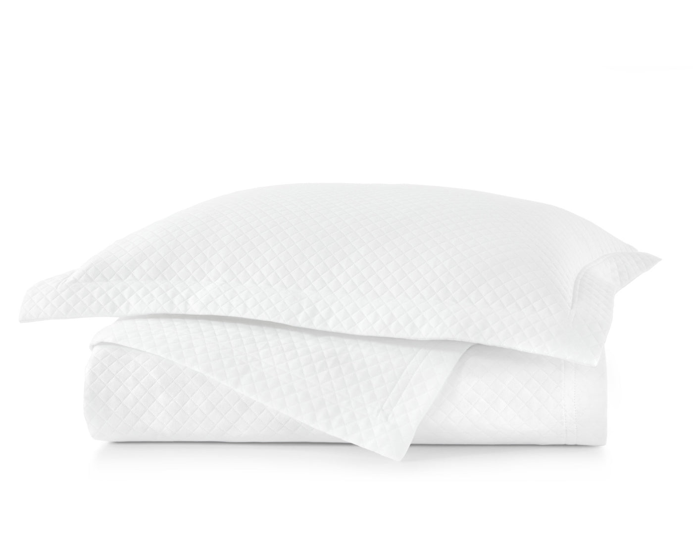 Peacock Alley Oxford matlesse coverlet and shams in white, neatly stacked